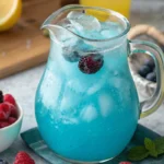 Refreshing Blue Raspberry Lemonade in a glass pitcher